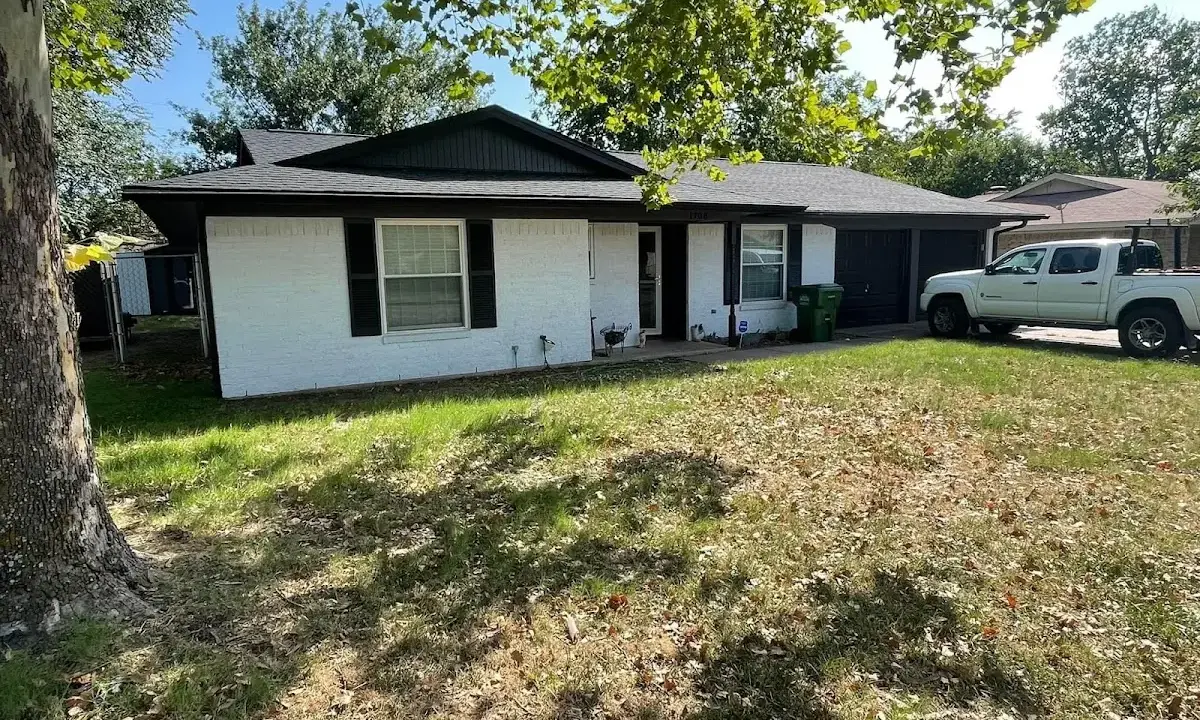 Professional roofing crew working on a residential roof in Salem Lakes